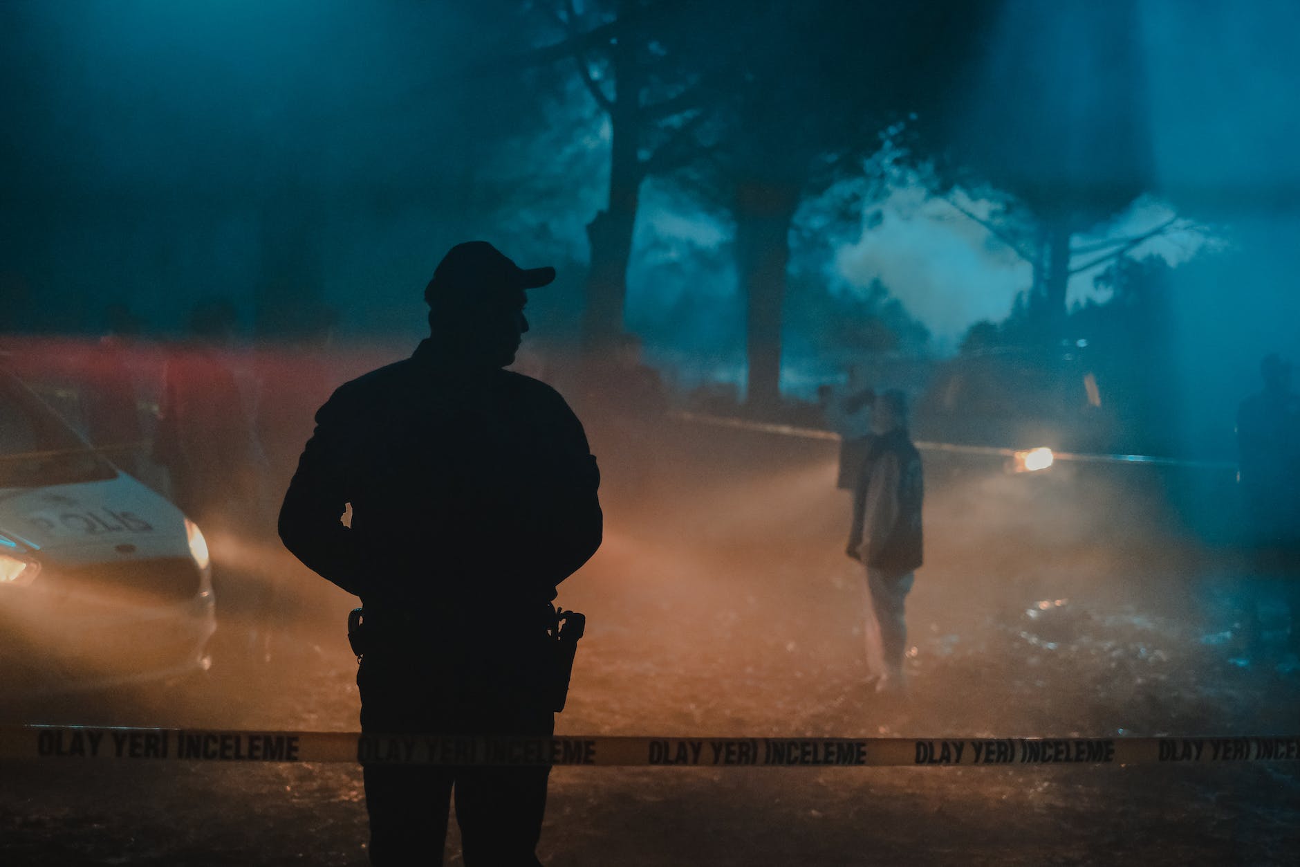 group of police officer and investigators work at crime scene