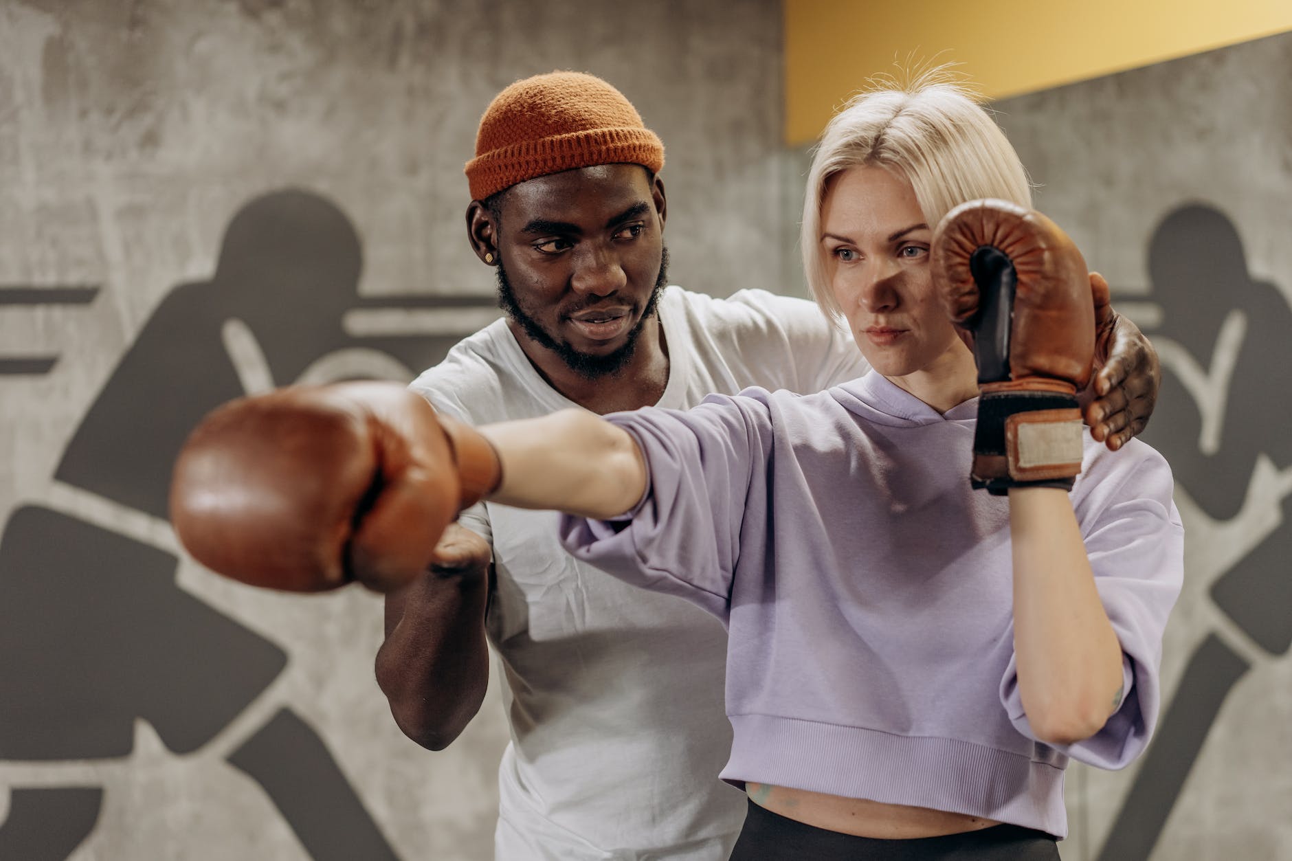 woman being trained in boxing