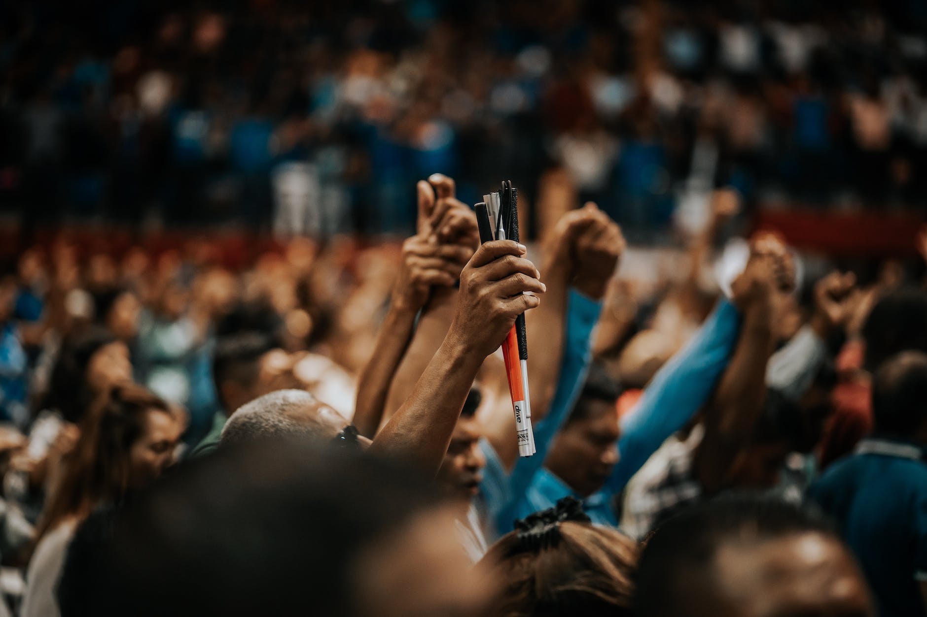 people raising their hands